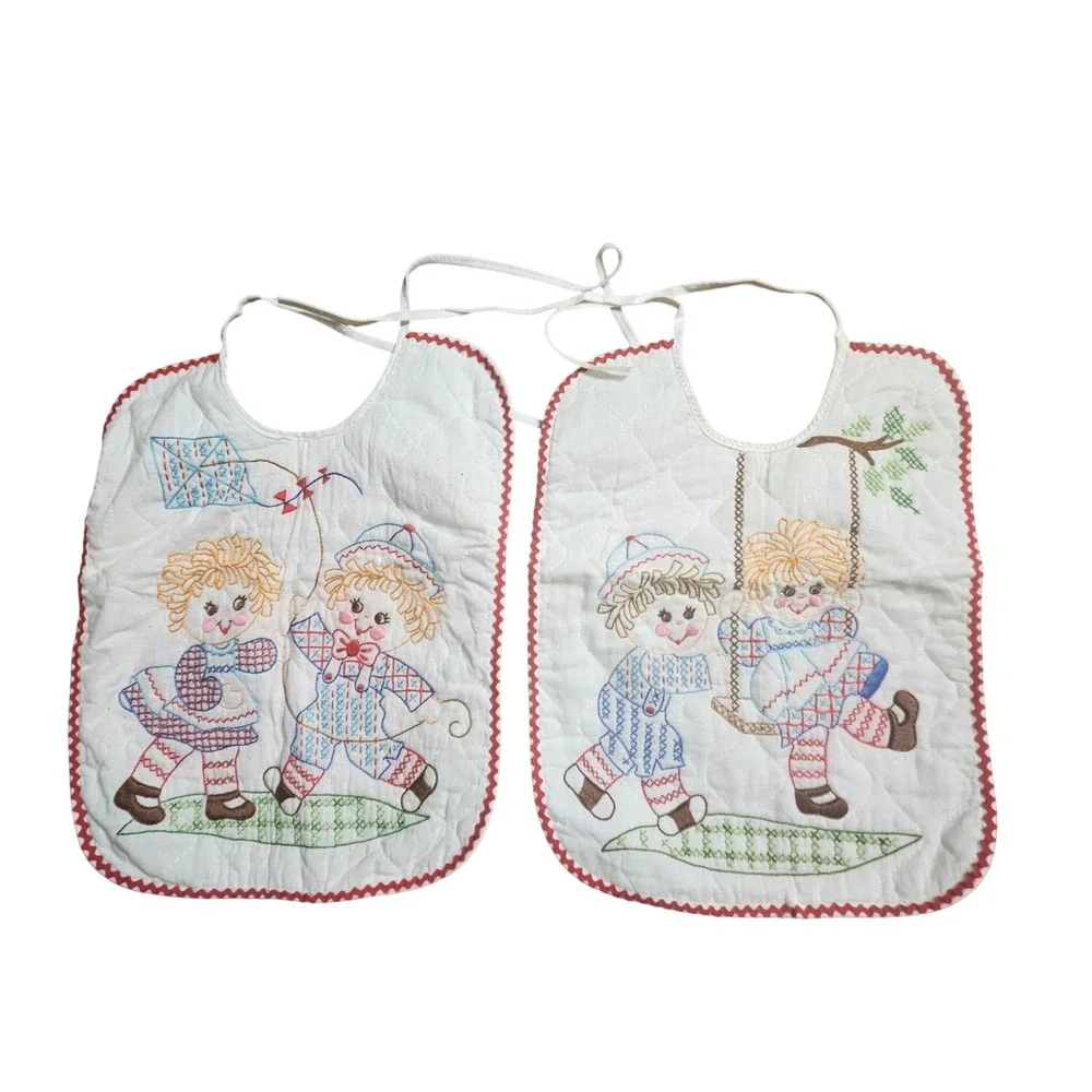 Lot of 2 Vintage Quilted Baby Bibs Embroidered Raggedy Ann Kite Swing Ric Rac
